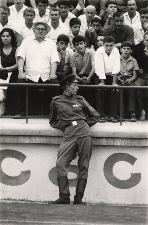 Tbilisi stadium, USSR. Soviet soldier during a Greece-USSR soccer match