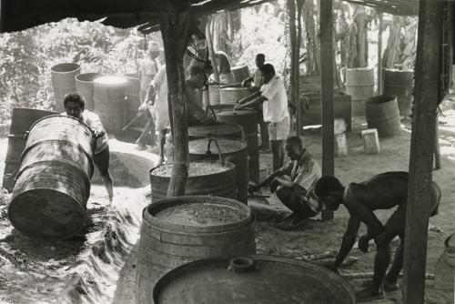 Men working with wooden barrels, Ghana