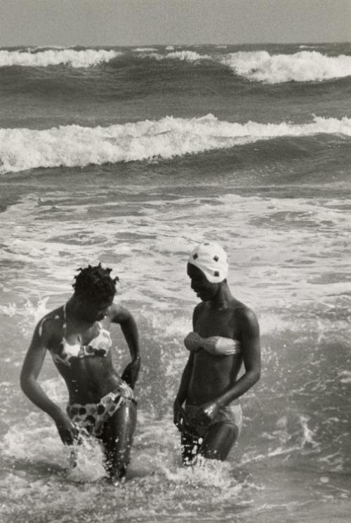 Women swimming in the ocean, Ghana