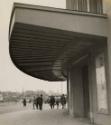 Gare de Caen: exterior of station with men and boys, France