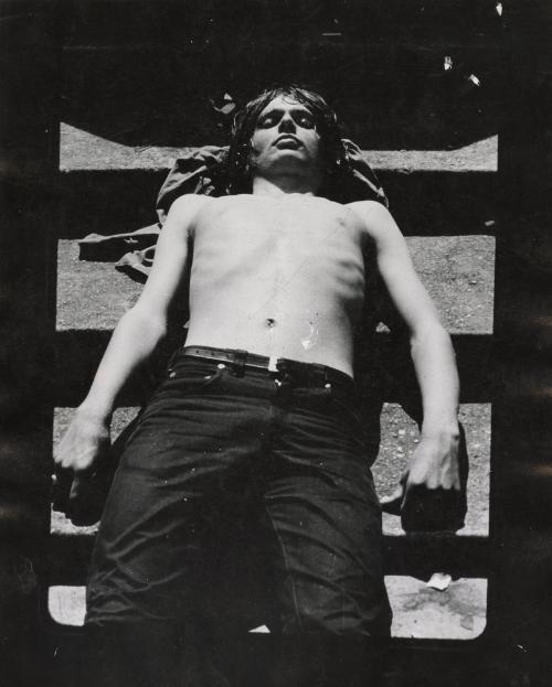 Man sunbathing on steps, New York City