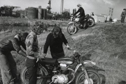 Boys admiring motorbike, Manchester, England