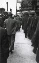 Men in line by drugstore