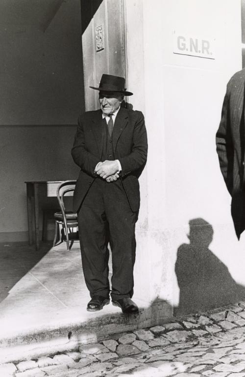 Village man in doorway, Portugal
