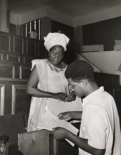 A mother and student in conference with her university professor, Ivory Coast or Nigeria