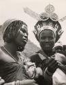 Zulu women show their jewelry to European visitors, South Africa