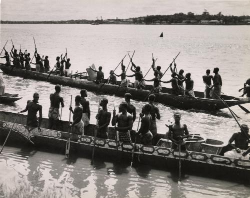A Congolese canoe that can carry 30-40 fishermen through the rapids of the river, the Belgian Congo (now Democratic Republic of the Congo)