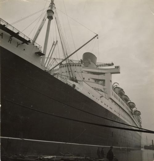 Latest Photos of the "Queen Mary" the largest ship of the world, which will go on her maiden voyage in May. Our photos show different views of the ship, the workers coming and leaving, ropes, chains, etc.