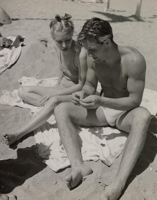 Attractive couple on beach, Deauville, France