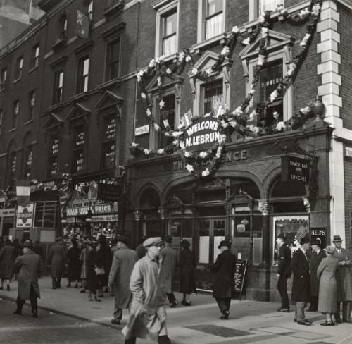 Arrival of the President of the Republic of France Albert Lebrun in London: A Whitheall Street with a sign on a bar reading "Welcome M. Lebrun", London