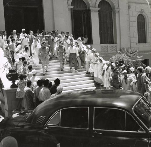 Canal Zone-Photos taken July 1953: General Naguib and party are shown leaving the Italian Catholic Hospital in Cairo. During a three-hour tour one day the General, accompanied by other officers, inspected schools and hospitals, Egypt.