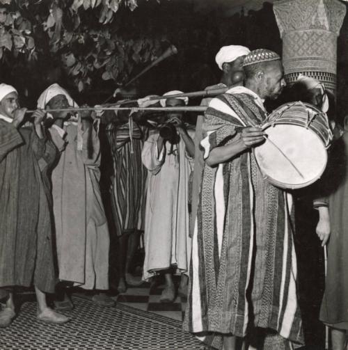 Arabian Nights in Morocco: With fabulous splendor and a dazzling display of Oriental pageantry Marrakesh (French Morocco) celebrated the simultaneous marriage of the three sons of its Pasha. / View of some of the musicians during the wedding feast. Tirelessly they played Moroccan folk tunes.